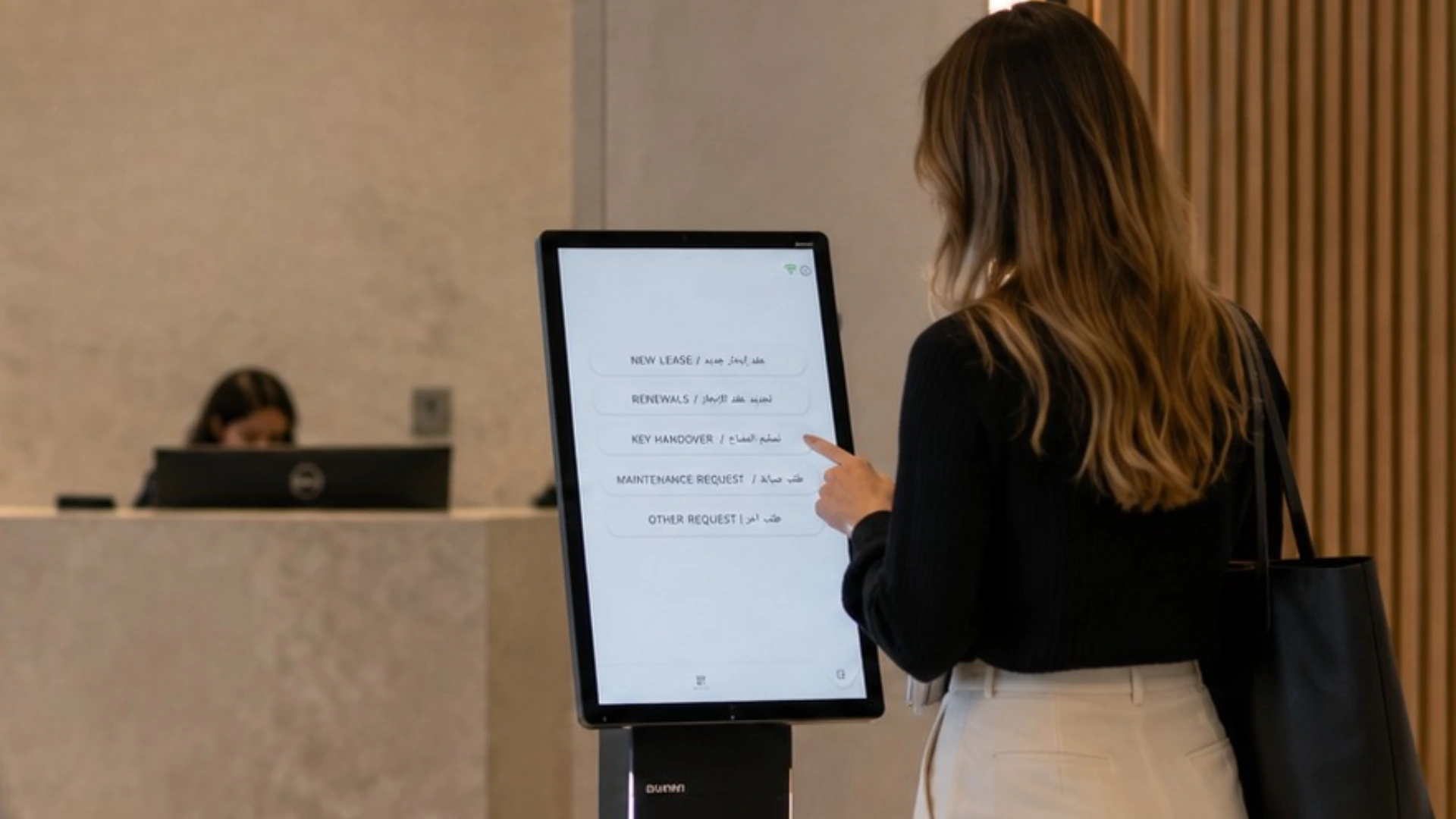 Entry2Exit queue management kiosk at the Avison Young office in Abu Dhabi